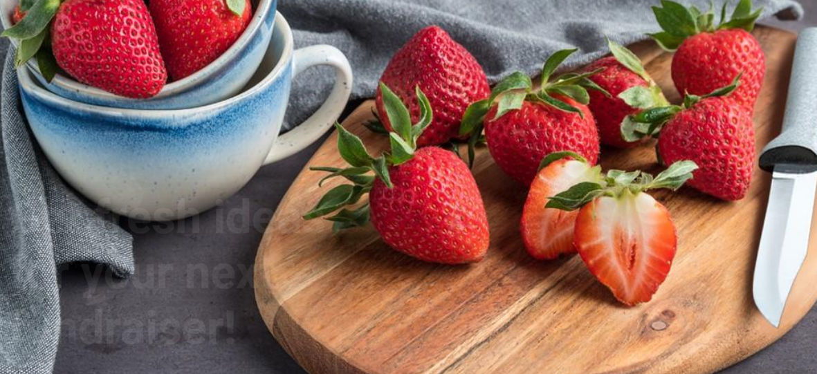 strawberries with cutting board